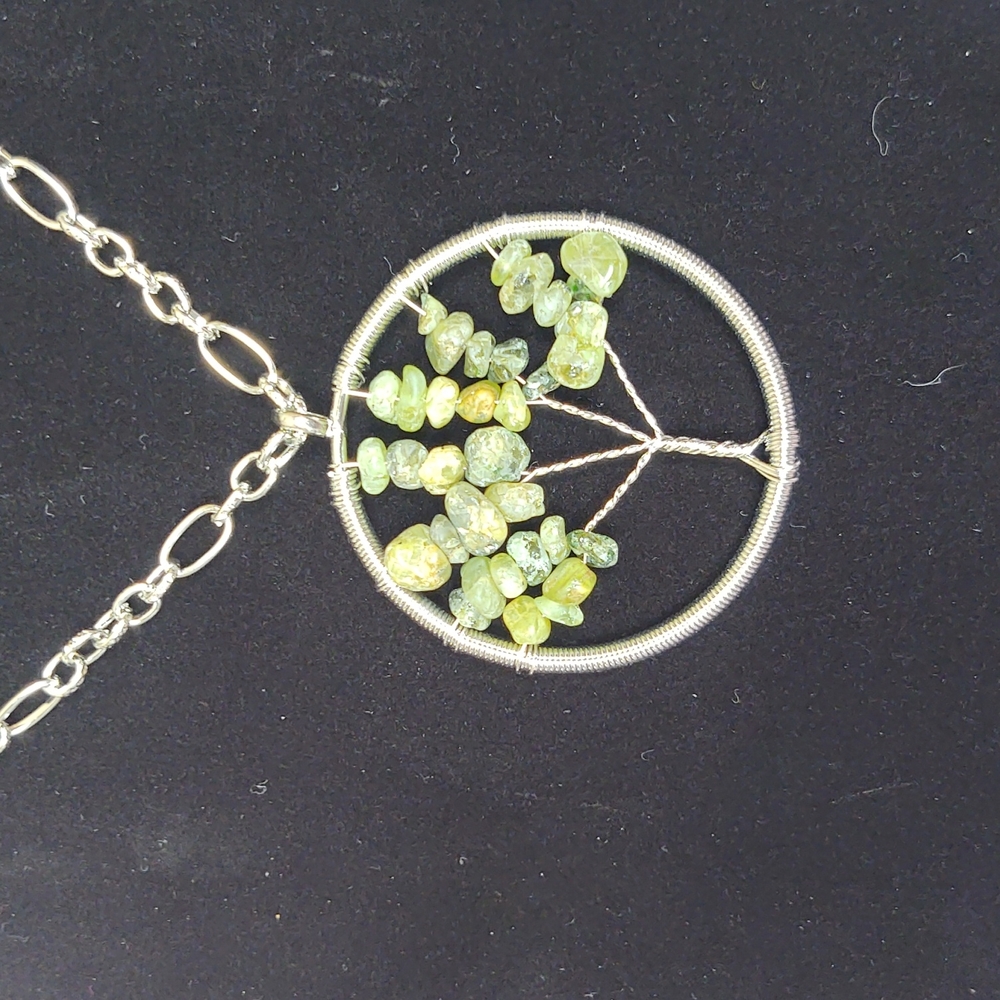 Chain is 26 in you can make it smaller it is Jade crystals hand wired in Sterlin